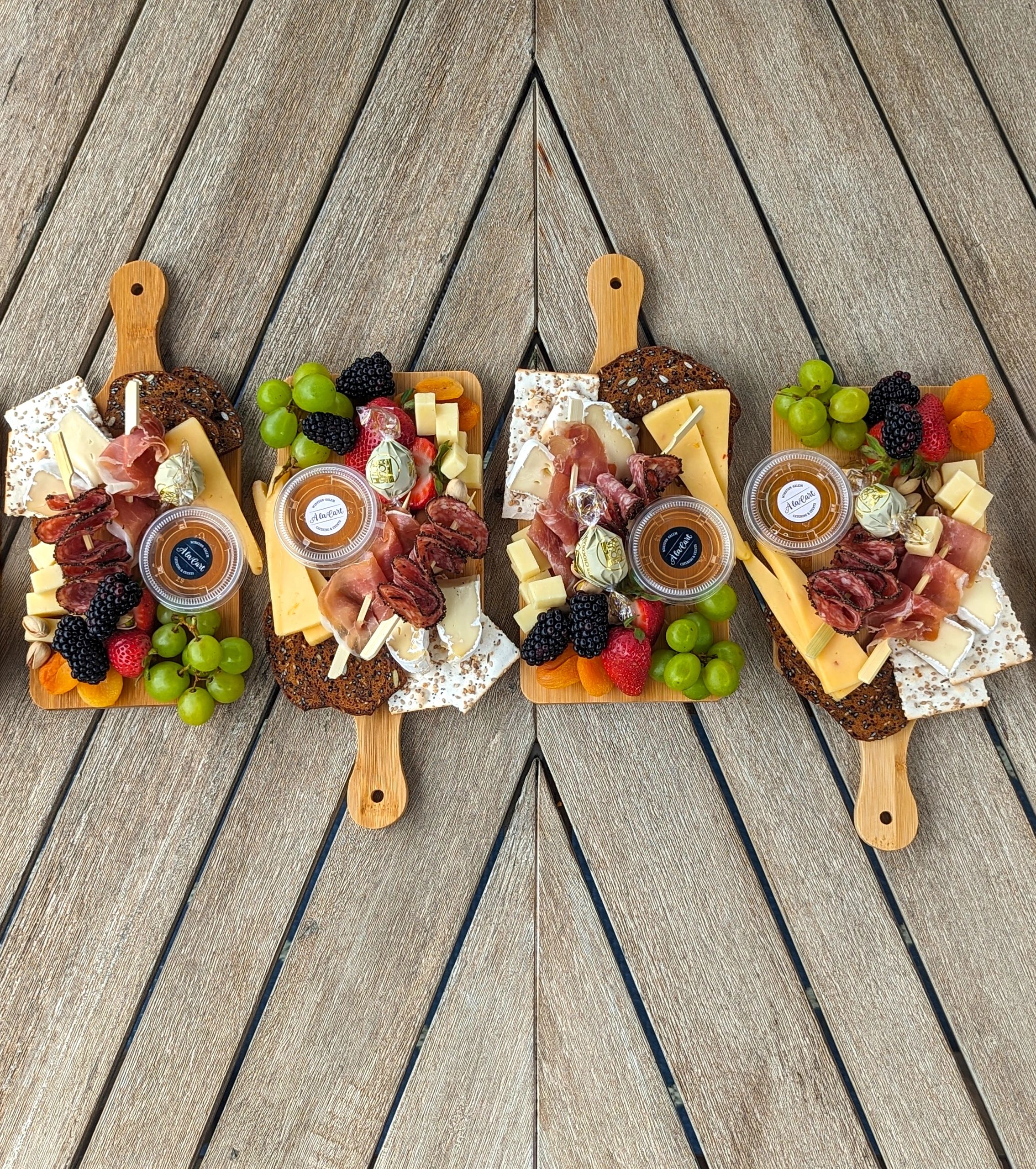 Boards In A Row - charcuterie by À La Cart Winston-Salem